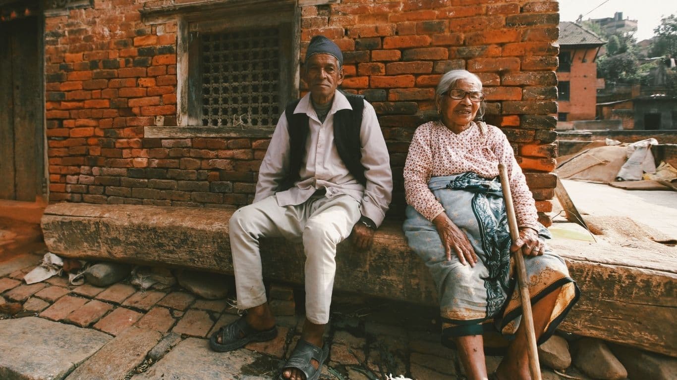 2 Nepalese older men taking a break, time works diffently in Nepal