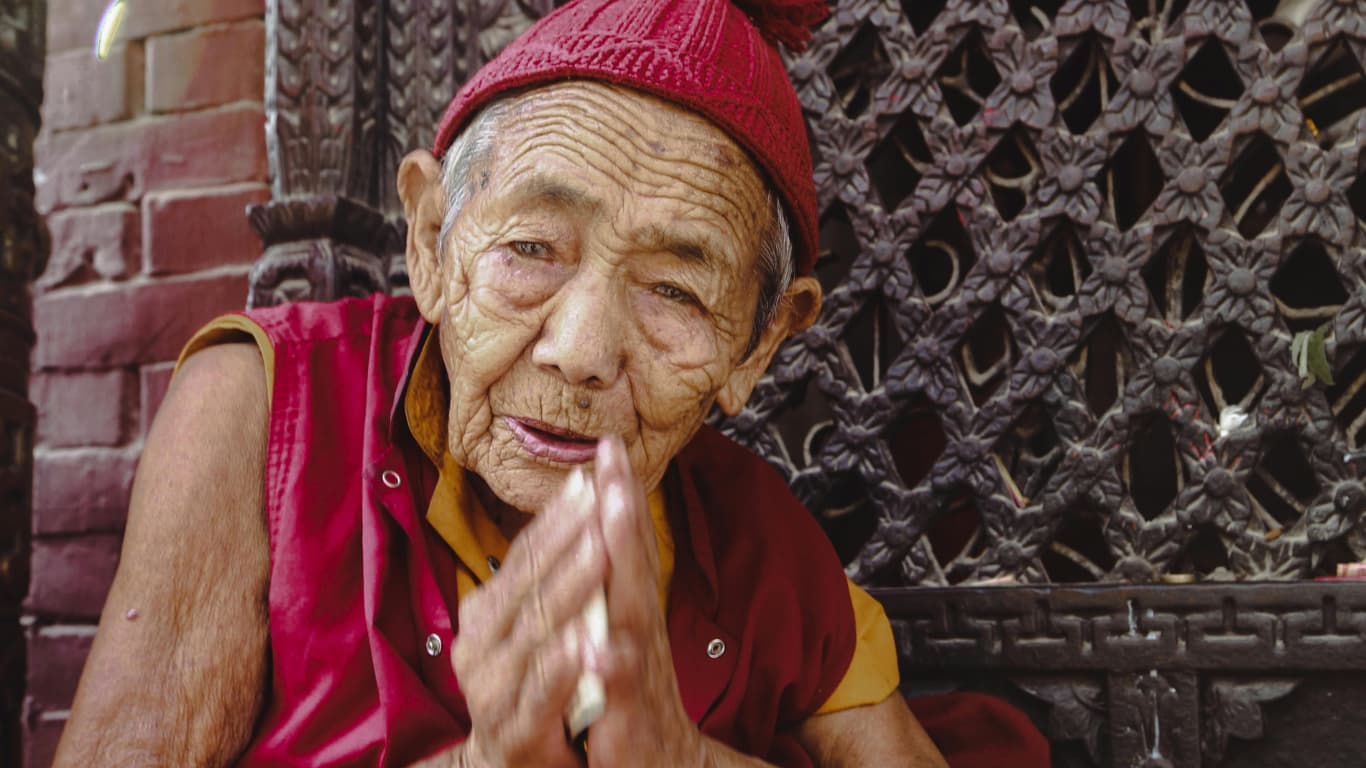 Nepalese hospitality is known all over the world, monk is greeting namaste to the travellers