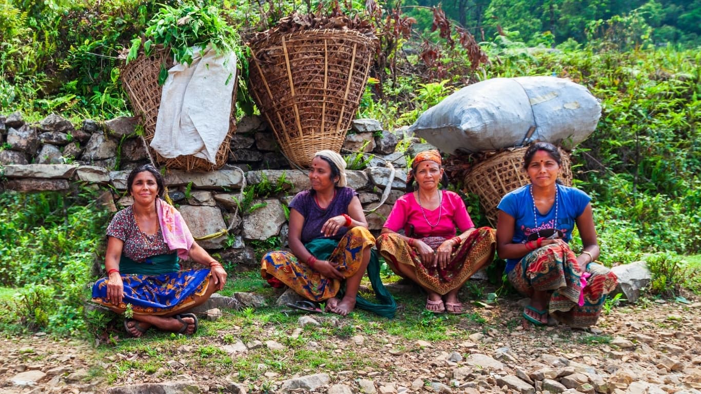 Women in Nepal resting after work in community forest