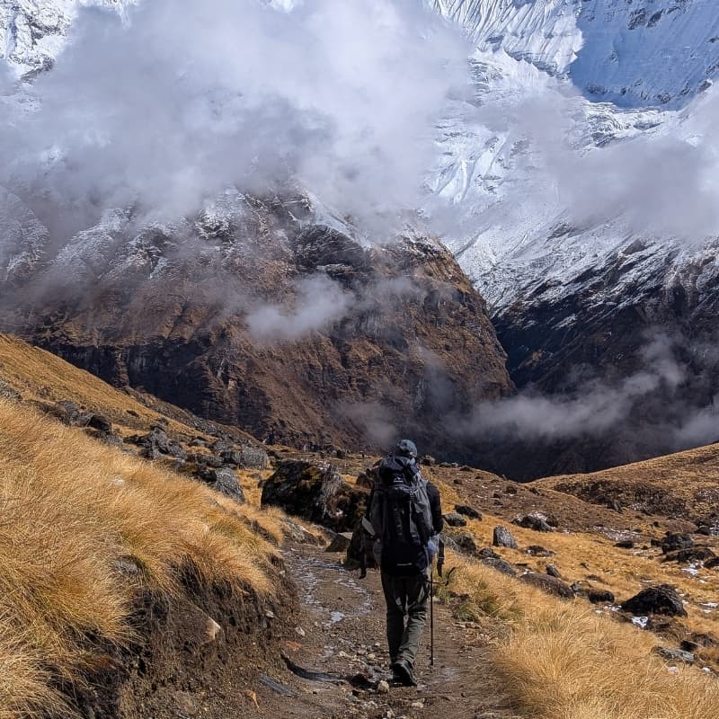 Trekker in the Nepalese Himalayas during foggy weather