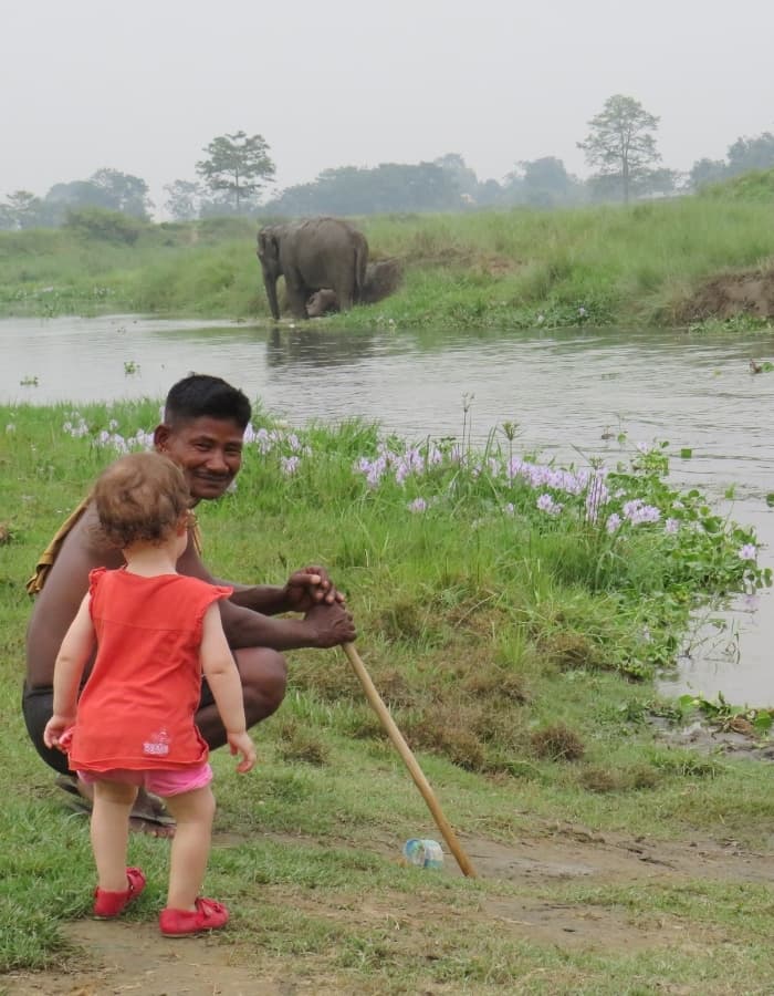 Girl with mahout and elephant near the river in Chitwan close to Sapana Lodge