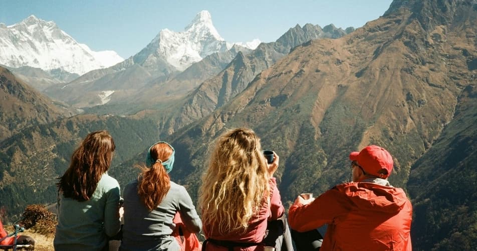 Trekkers taking their time to enjoy the Ama Dablam view during trek
