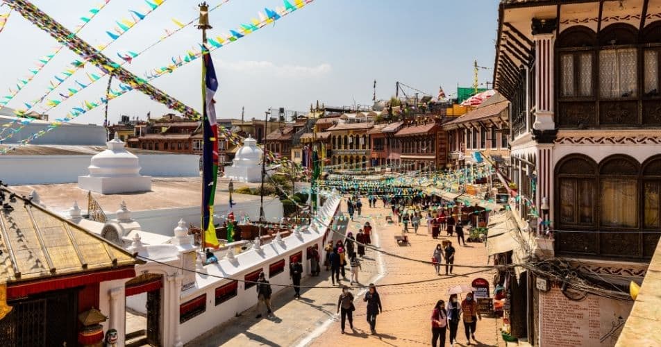 Rest and chaos around Boudhanath stupa in Nepal