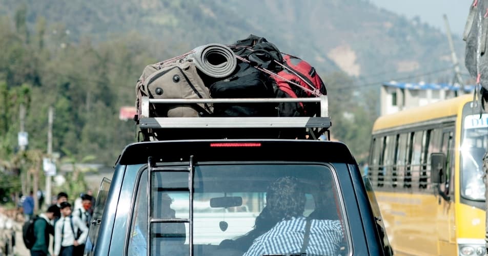 Nepali car on the roads, with luggage on the roof, travelling takes time to travel