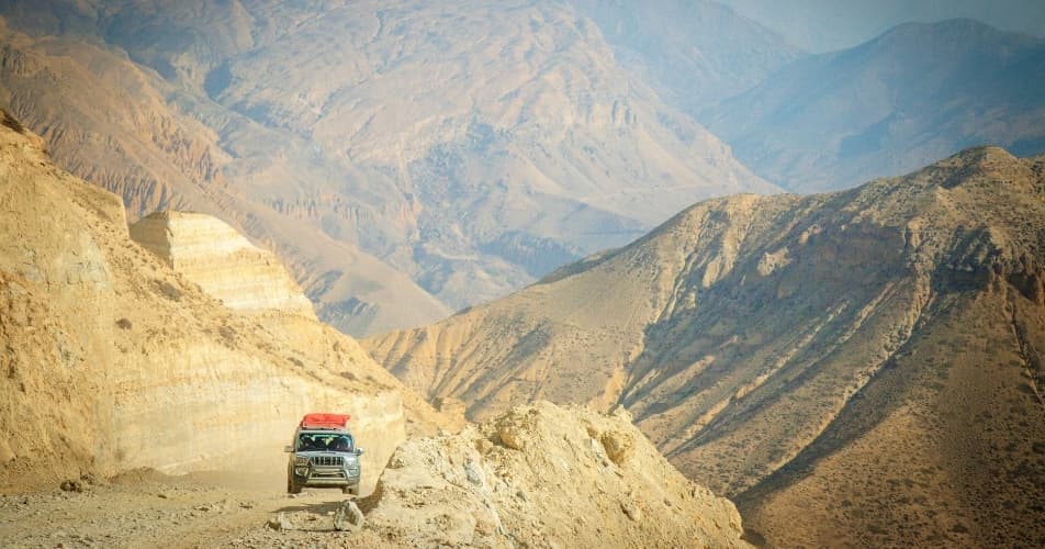 Jeep driving on the mountainous roads in Nepal, travelling goes slow in Nepal