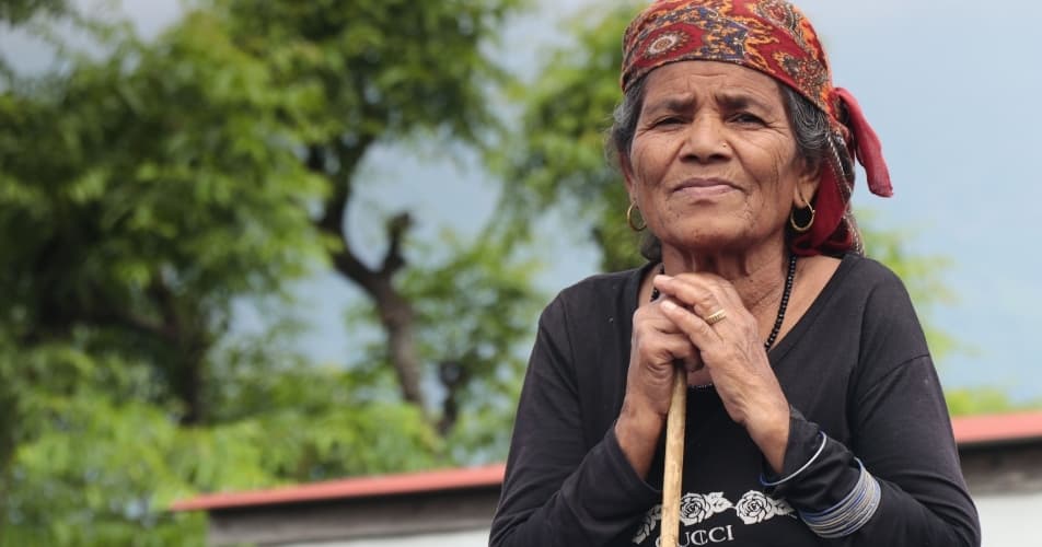 Respect for elderly people is part of Nepal, an elderly Nepalese lady on the land